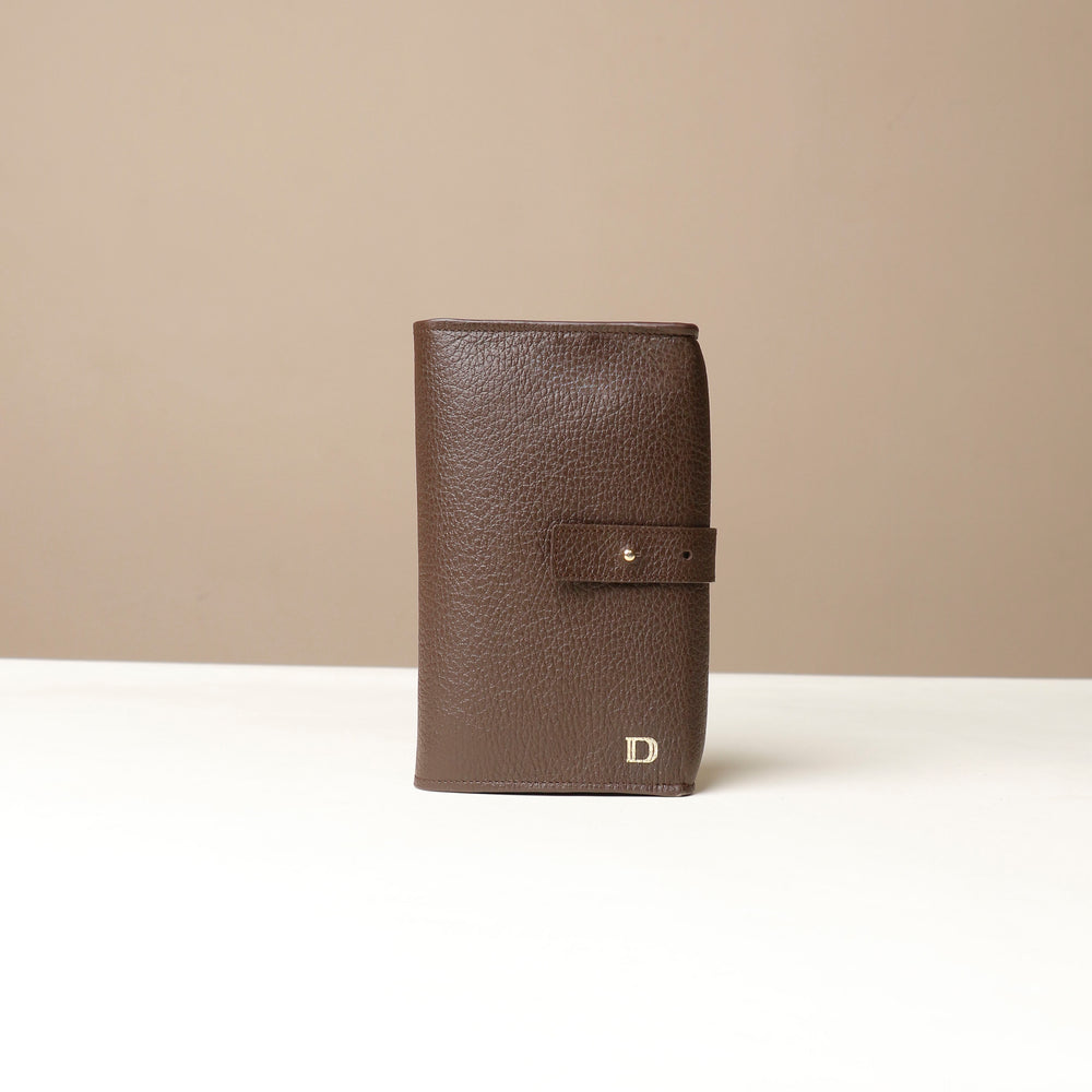 Front view of a brown Danilos Pebble executive accessory holder linea on a beige background
