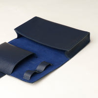 close up view of a  open marine blue Danilos Pebble executive accessory holder linea on a beige background