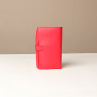 back view of a red Danilos Pebble executive accessory holder linea on a beige background