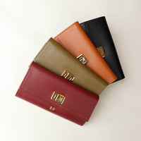 Front view of the Danilos Leather jewelry organizer Mishka in red, green, brown and bllack in a beige background