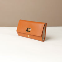 Side view of the Danilos Leather jewelry organizer Mishka in brown with gold accents in a beige background