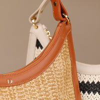 Angled view of Luna Palmera raffia tote bag