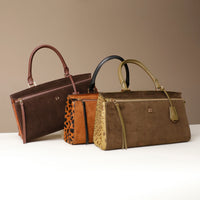 Three Danilos handbags in brown, light brown, and green on a white surface with a beige background