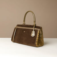 Green suede Danilos handbag with a leopard print flap on a beige background