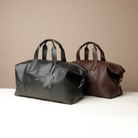 Two leather bags, one black and one brown, on a beige background