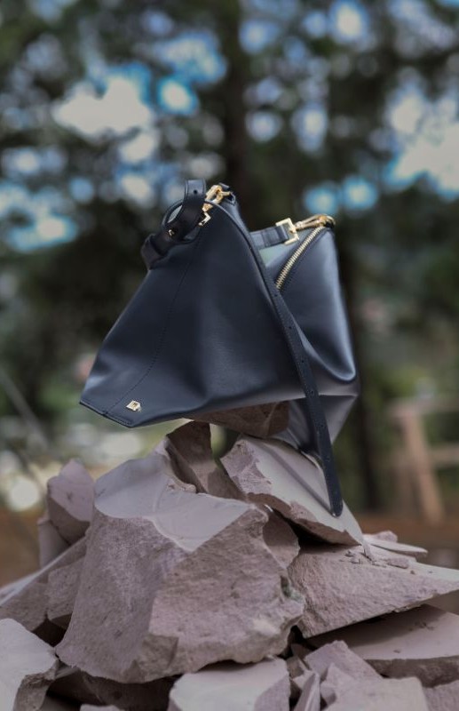 The Papillon bag staged on quarry stone